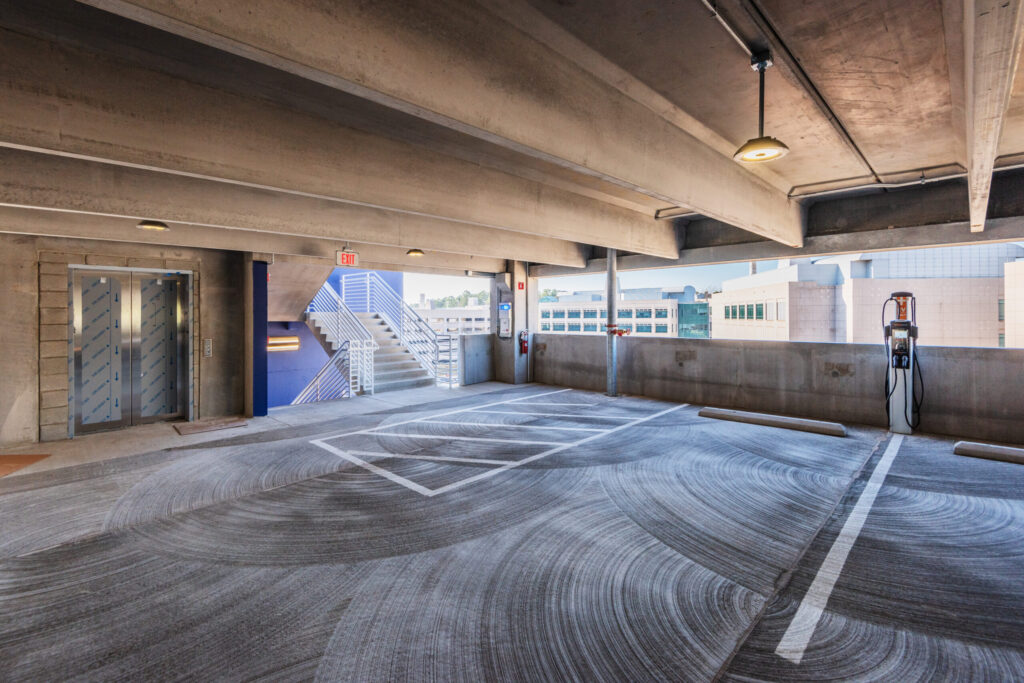 Elevator and Electric Car Charging Station inside Parking Deck