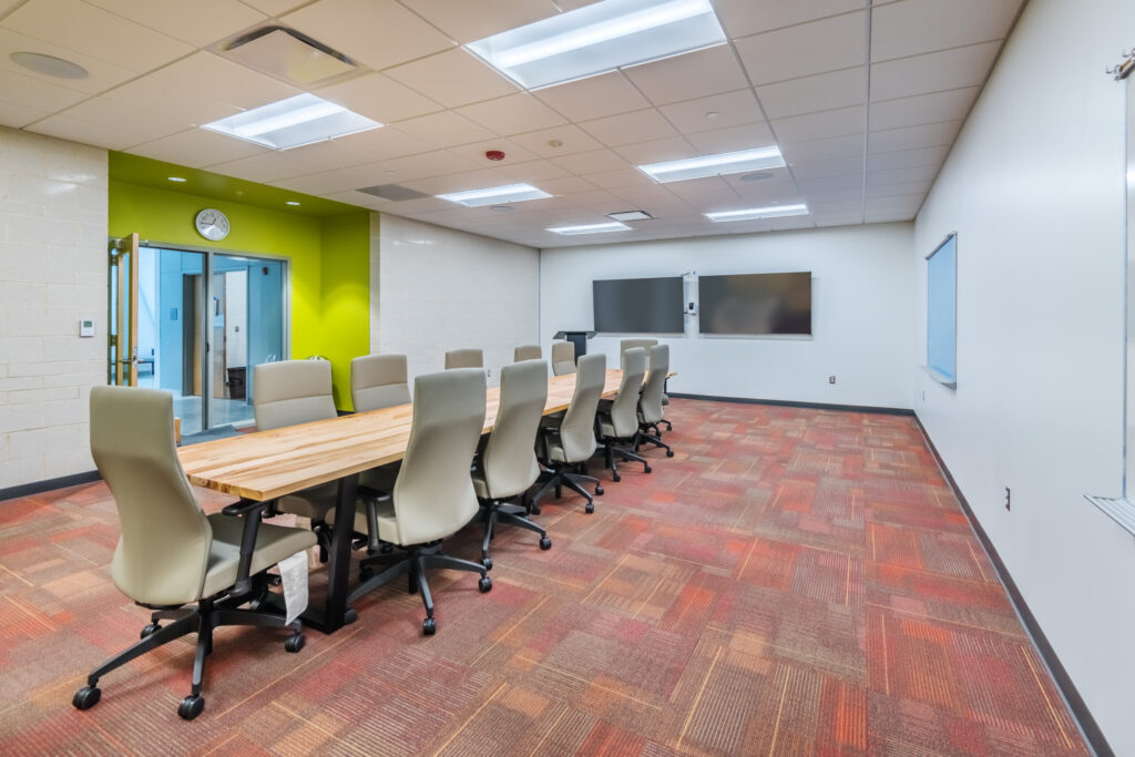 Apex Senior Center Meeting Room with a Long Table and Two TVs