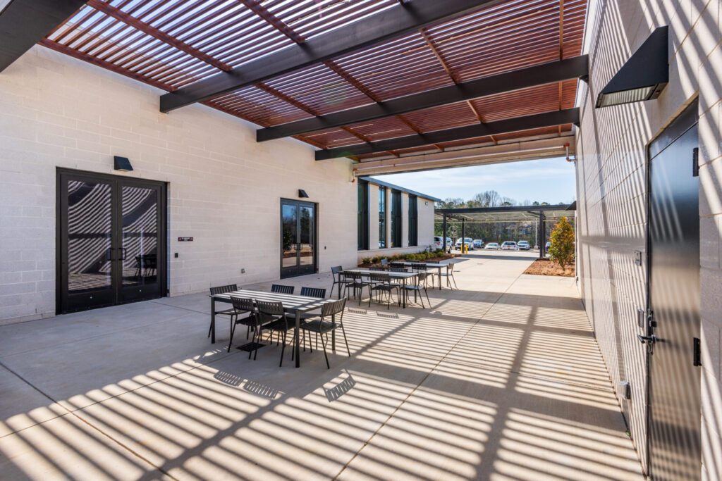 Covered Outdoor Gathering Area with Tables and Chairs