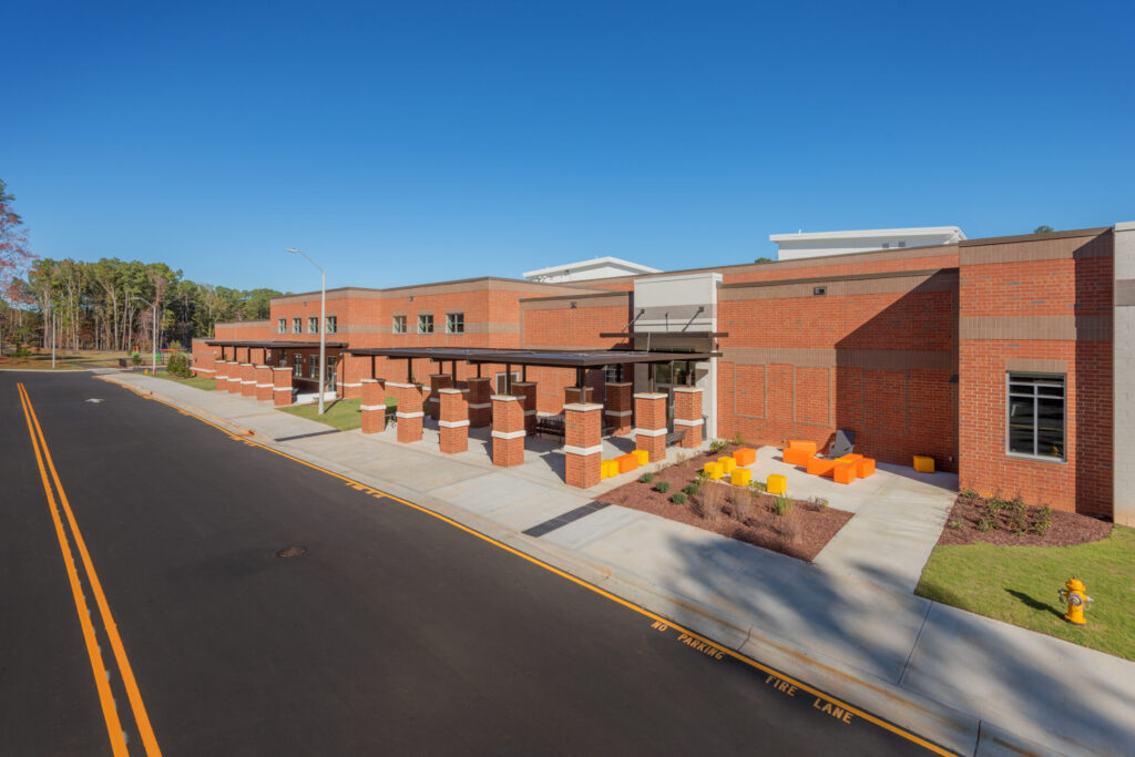 Barton Pond Elementary School Outdoor Gathering Areas with Orange and Yellow Cubes