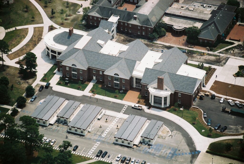 Aerial View of Brick Building and Parking Lot