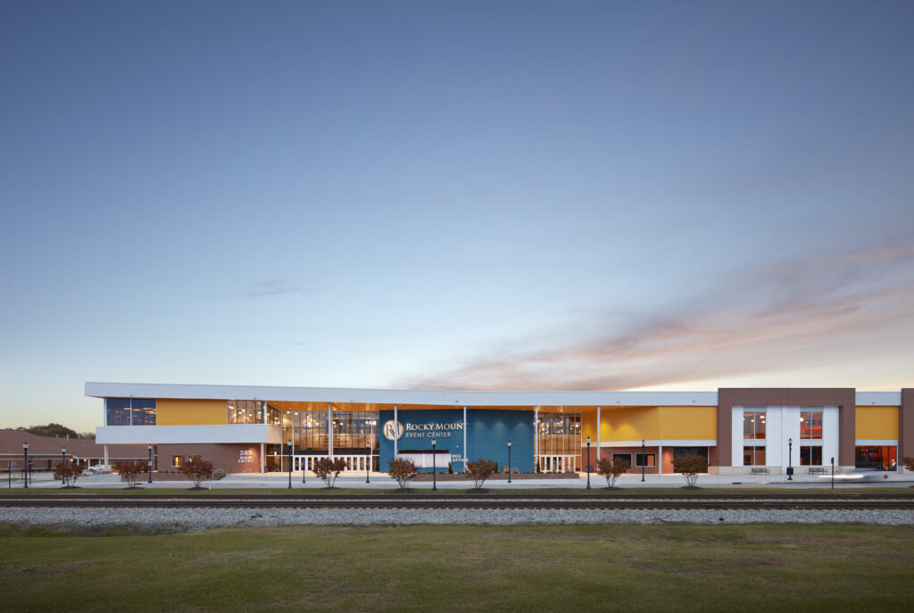 Rocky Mount Event Center Main Entrance at Dusk with Train Tracks