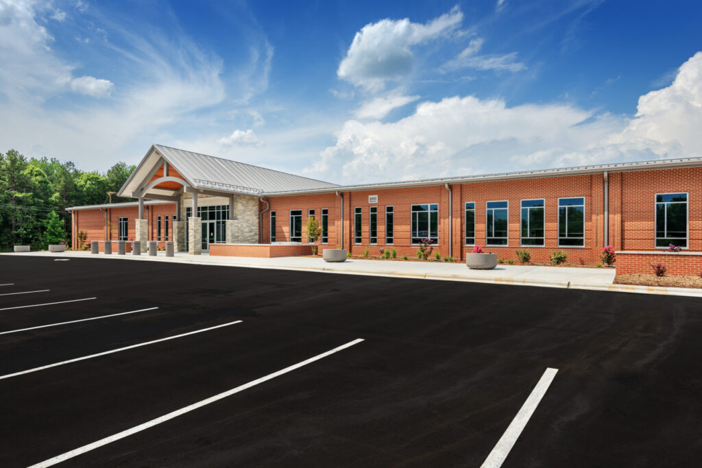 Parking Lot and Brick Building