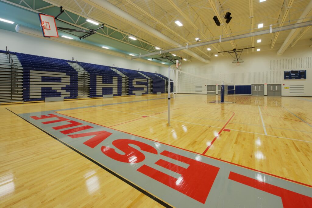 Gymnasium with Basketball Court and Bleachers