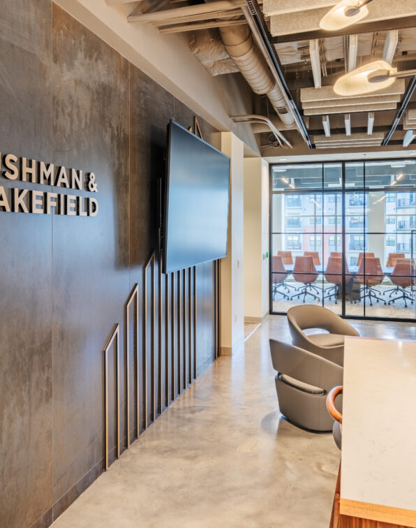 Lobby of Cushman & Wakefield with Name and TV on Wall