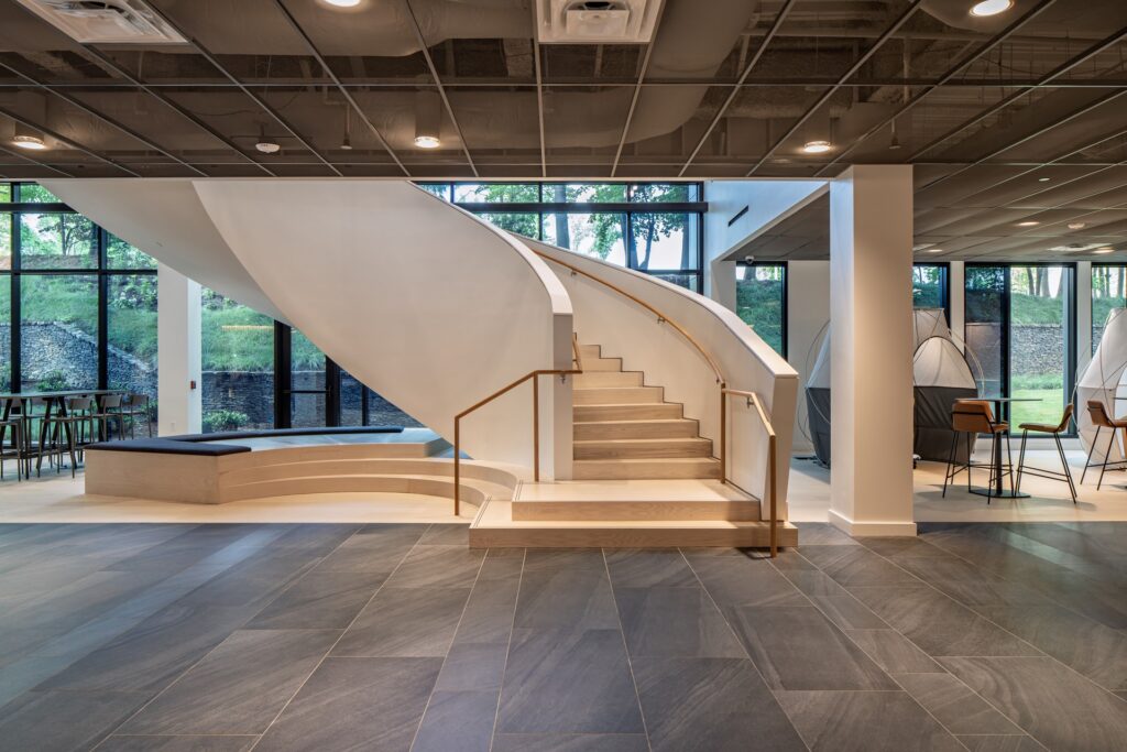 Central architectural staircase inside renovated headquarters.
