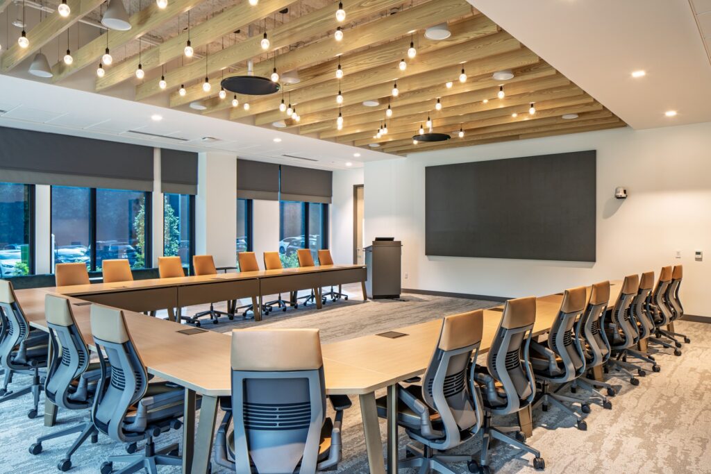 Modern conference room inside Coastal Credit Union headquarters renovation.